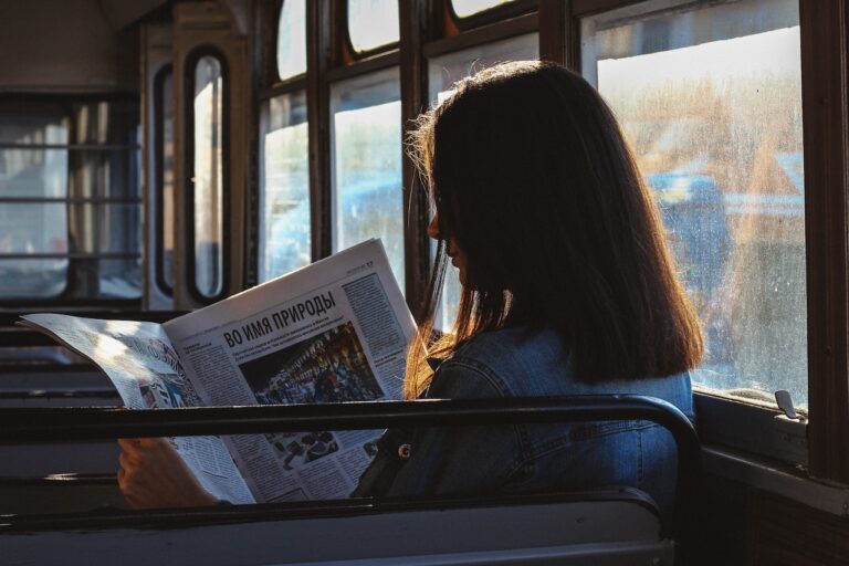 A woman checking Newspaper Advertisement
